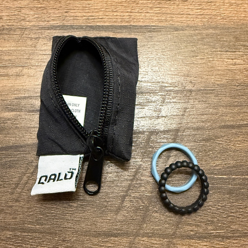 Textured Black and Blue Qalo Silicone Rings with Pouch